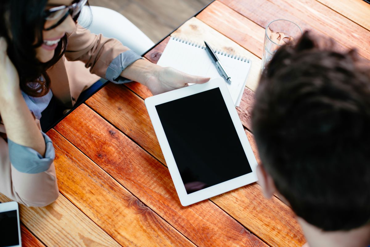 Someone looking at a tablet screen